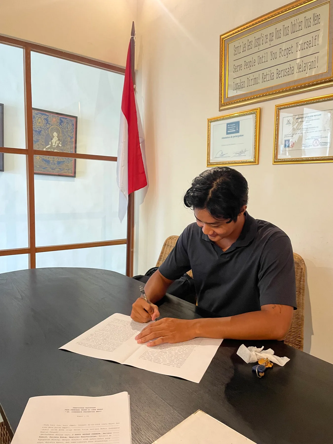 Overseas property buyer signing documents with BALI STRAT guidance